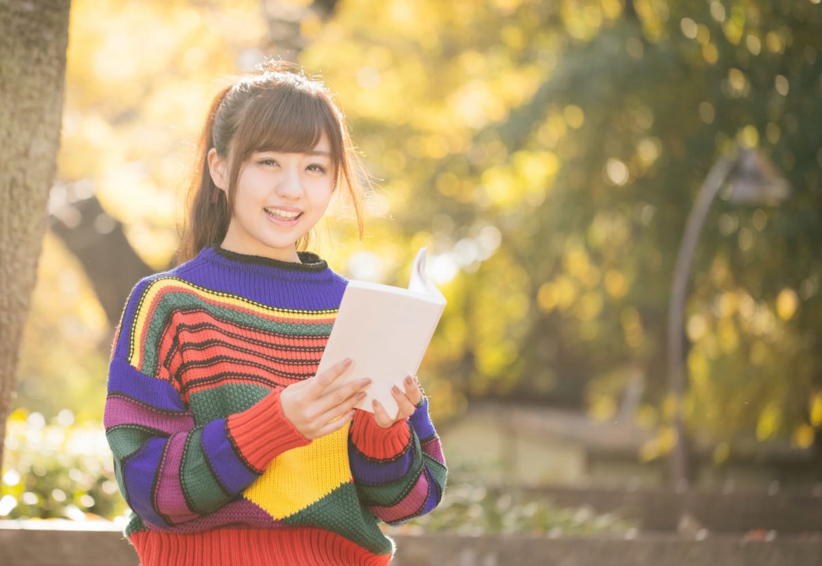 yuka-smiling-and-reading-a-book.jpg