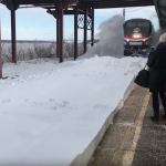Train-arriving-at-snow-filled-station.png
