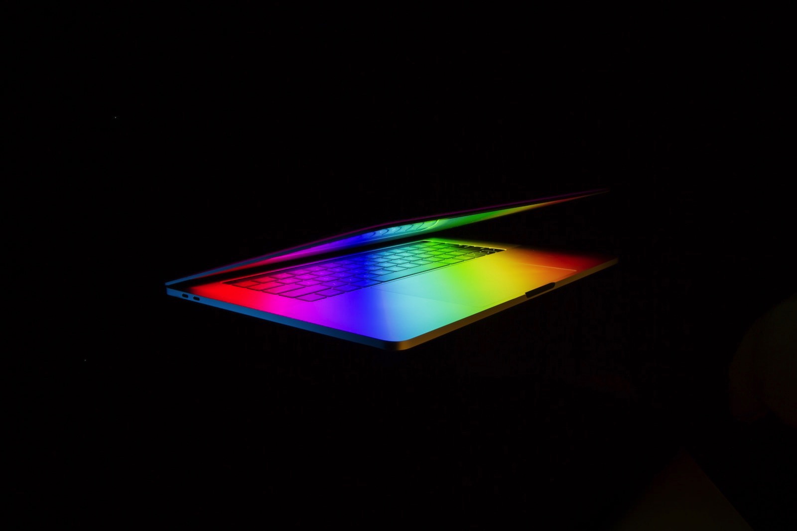 ash-edmonds-490789-unsplash-macbook-pro-rainbow-dramatic.jpg