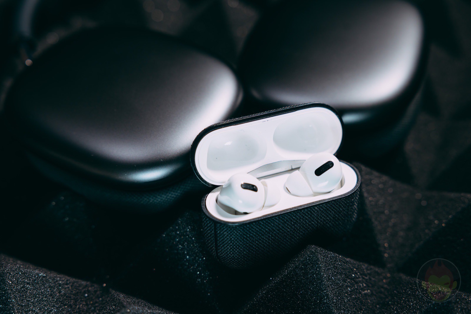 AirPods Pro with AirPods Max behind 03